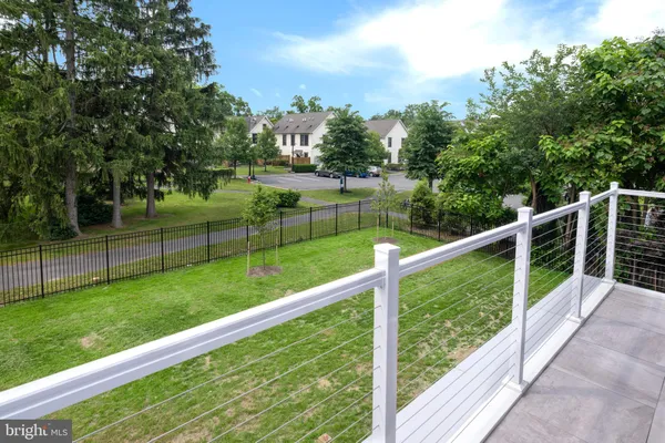 a view of a deck with a big yard