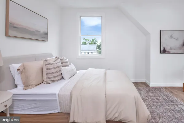 a bedroom with bed and window