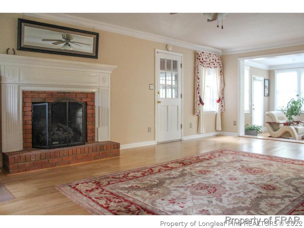 708 Garden Road Aberdeen, NC 28315 - Photo 8 of 25 a view of a living room and a fireplace
