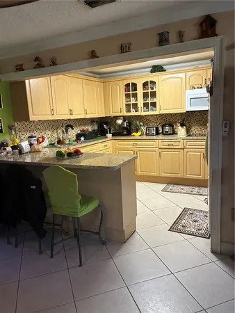 a kitchen with a cabinets and appliances