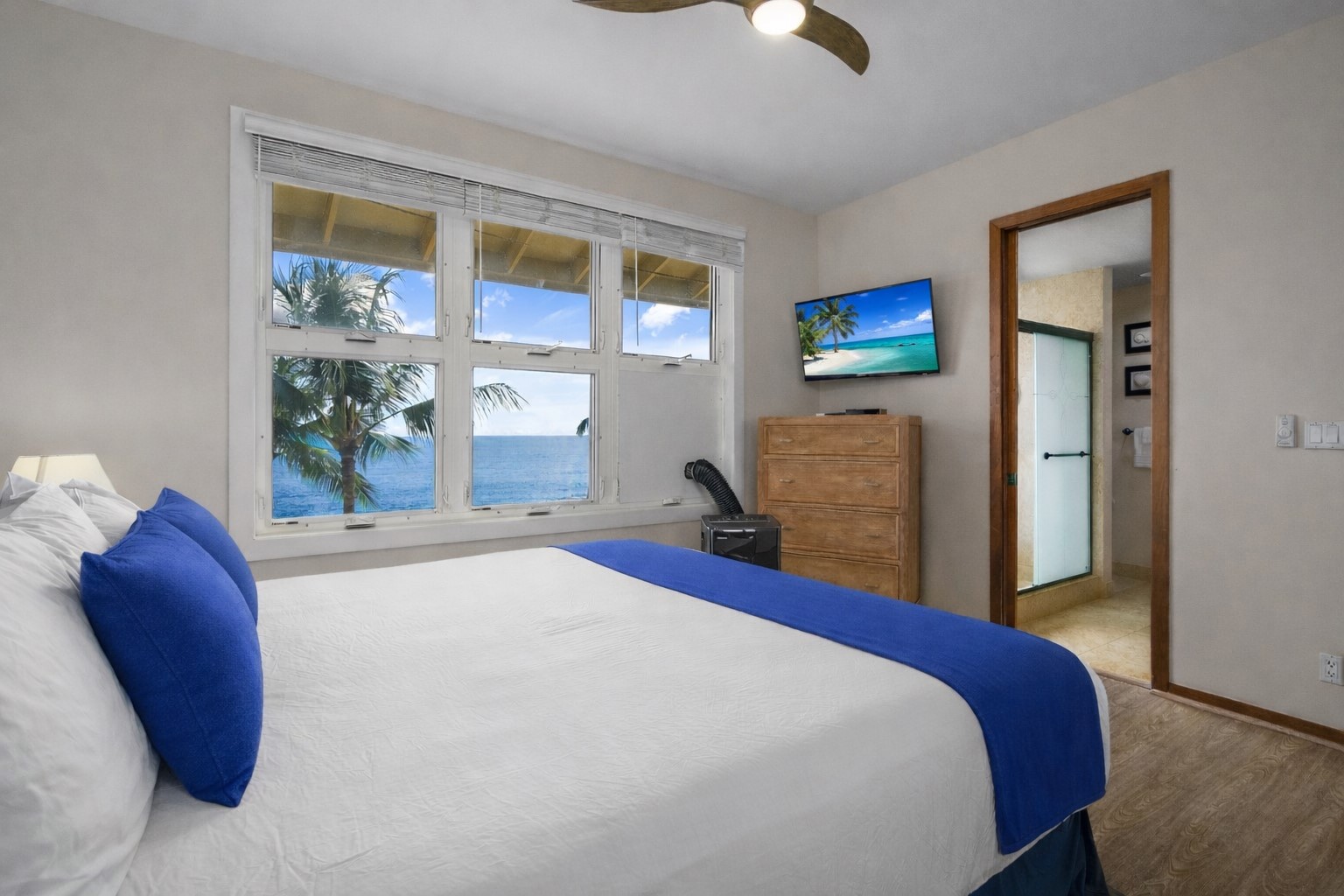 2640 Puuholo Road, Unit 231 Koloa, HI 96756 - Photo 15 of 30 a bedroom with a large bed and a large window