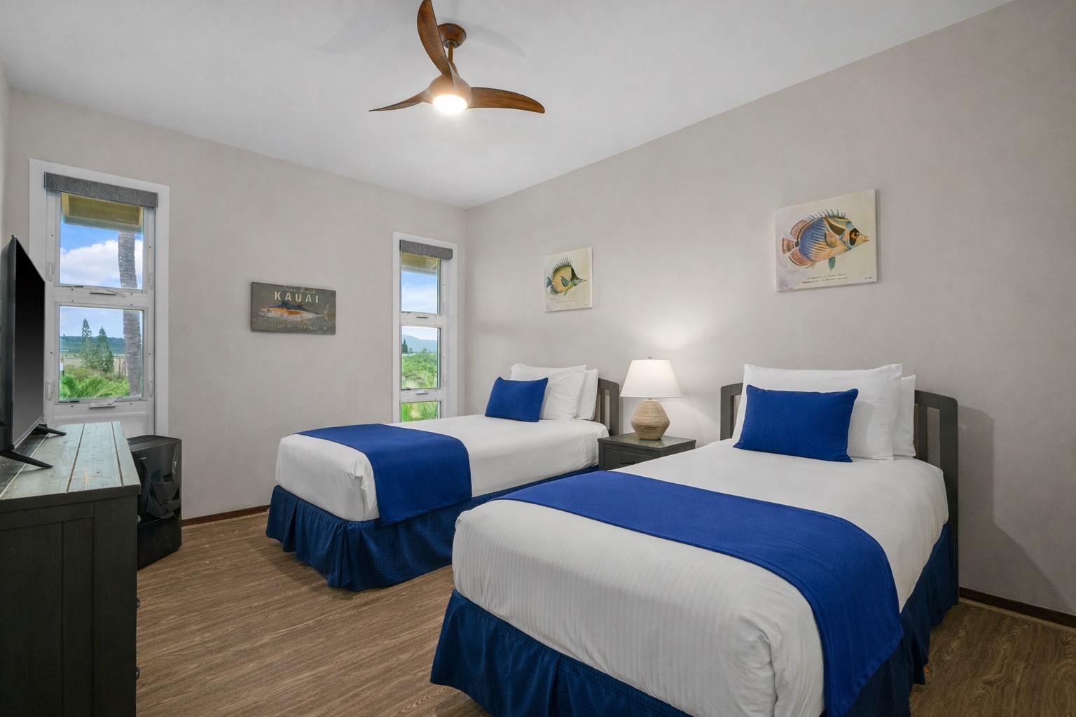 2640 Puuholo Road, Unit 231 Koloa, HI 96756 - Photo 17 of 30 a bedroom with two beds and a flat screen tv