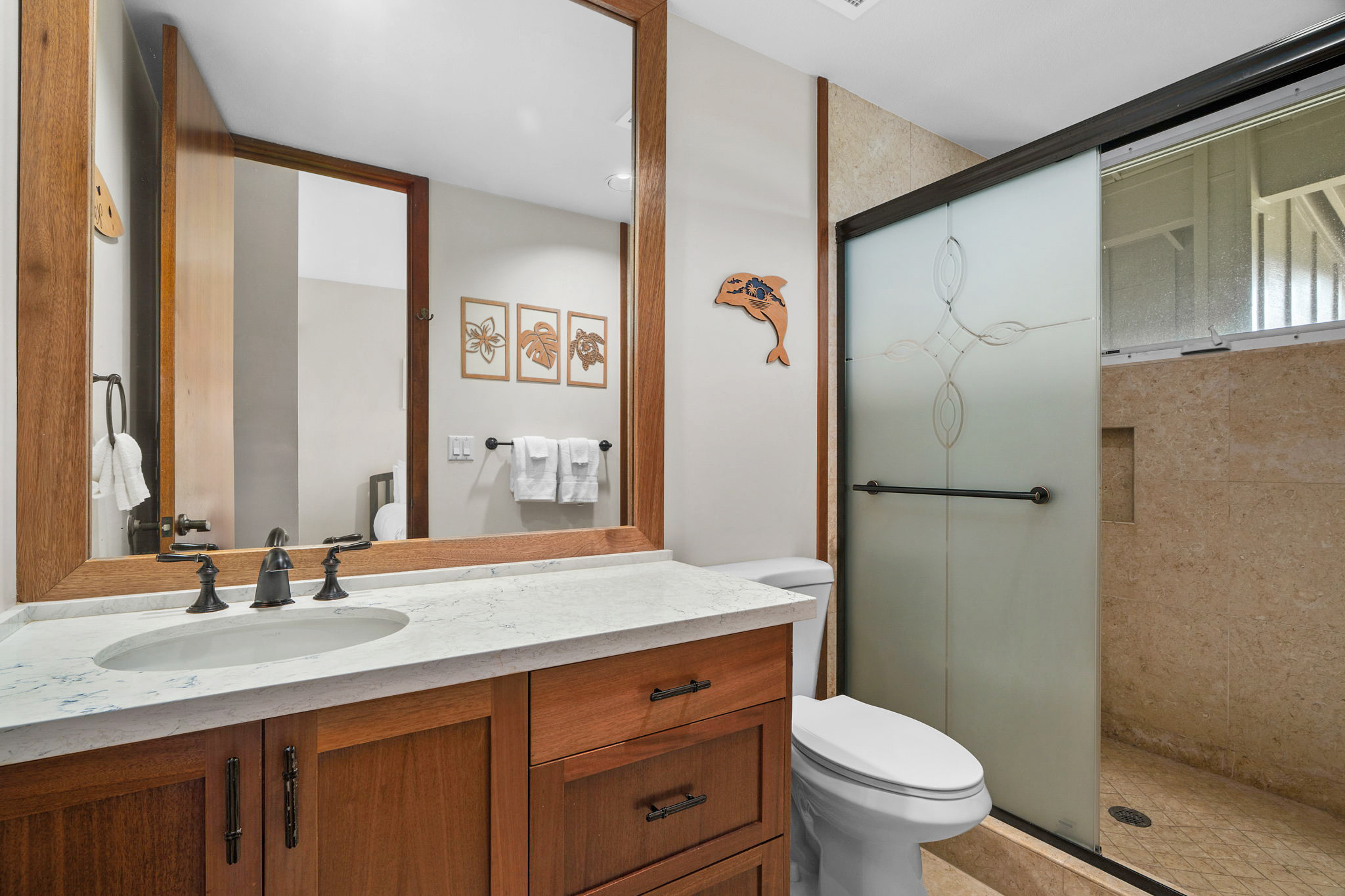2640 Puuholo Road, Unit 231 Koloa, HI 96756 - Photo 18 of 30 a bathroom with a double vanity sink toilet and a mirror