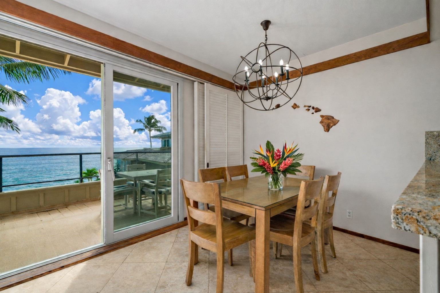 2640 Puuholo Road, Unit 231 Koloa, HI 96756 - Photo 7 of 30 a view of a dining room with furniture a chandelier and wooden floor