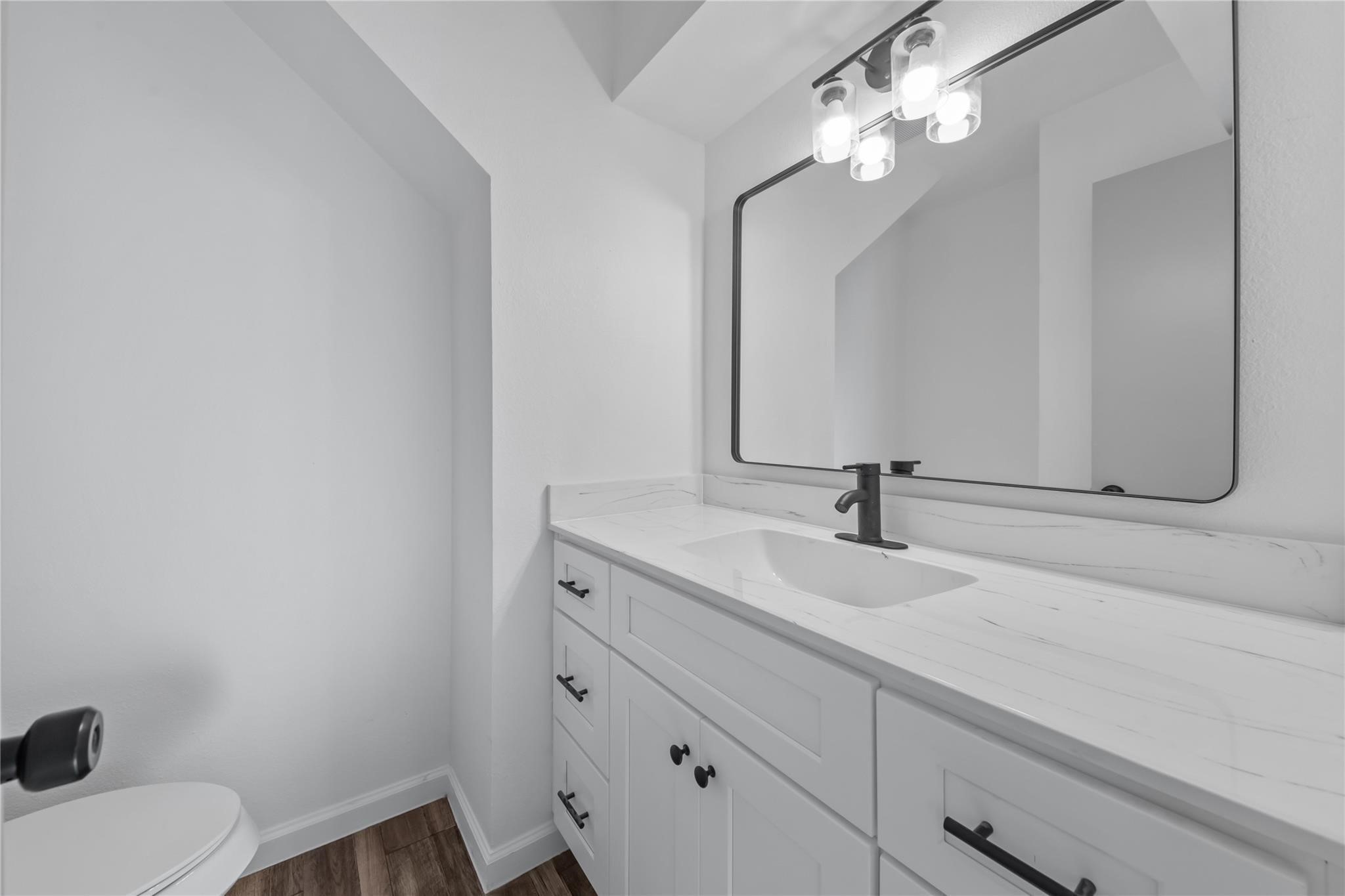 6611 Falling Waters Drive Spring, TX 77379 - Photo 11 of 16 a bathroom with a sink and a mirror
