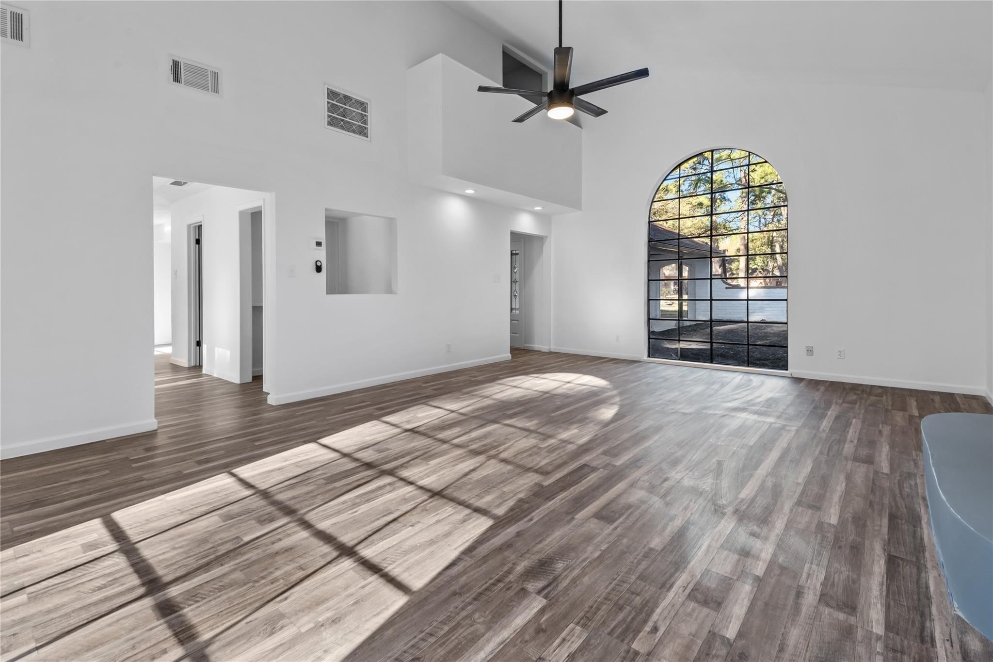 6611 Falling Waters Drive Spring, TX 77379 - Photo 5 of 16 wooden floor in an empty room with a window