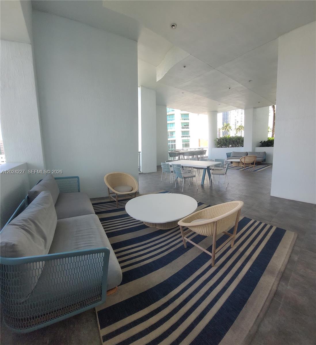 90 Southwest 3rd Street, Unit 2208 Miami, FL 33130 - Photo 54 of 56 a living room with furniture and a table