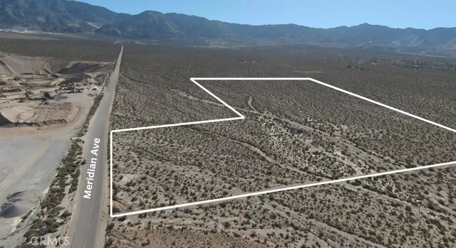 a view of small space with mountain view