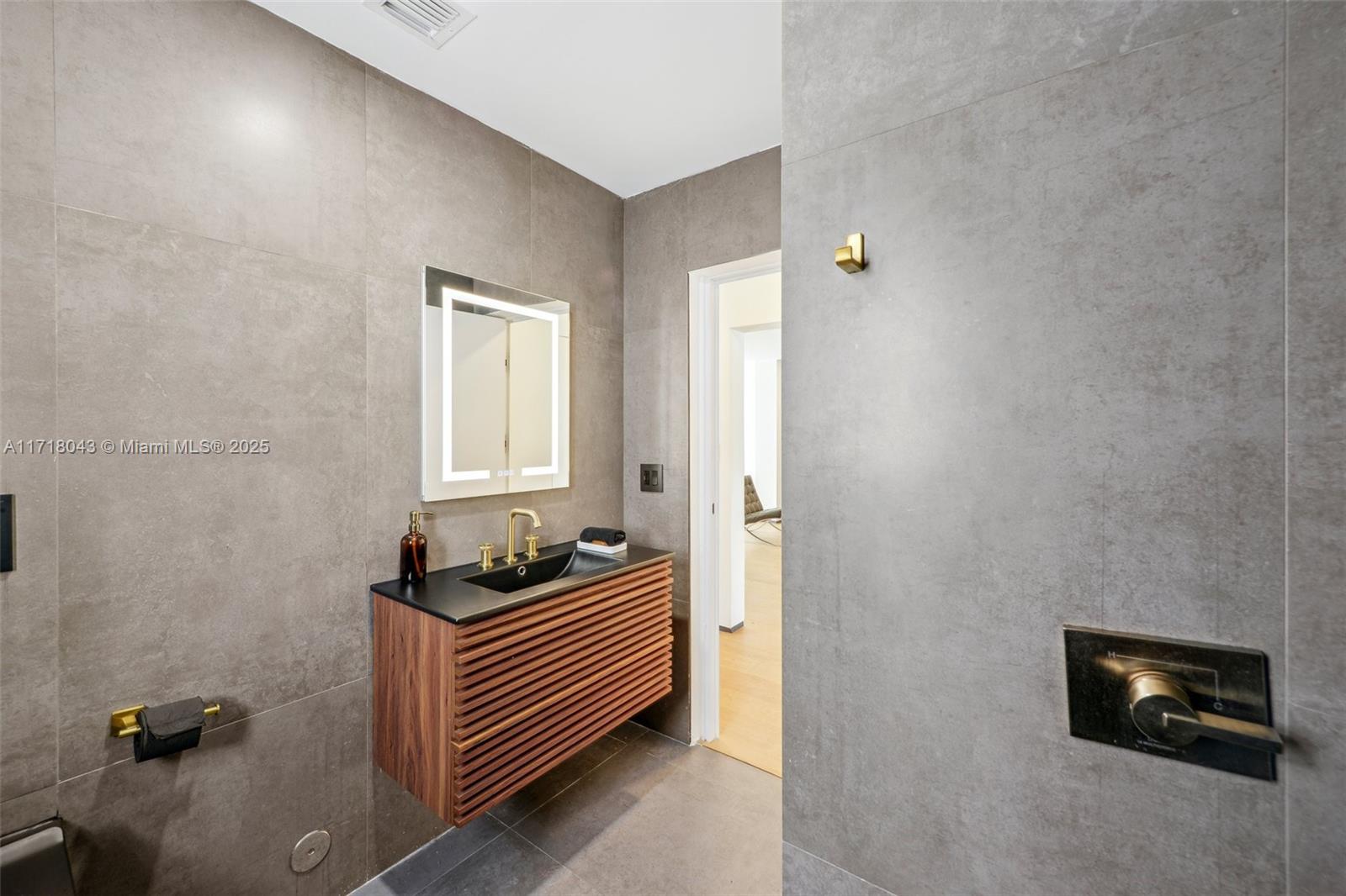 2725 Southwest 19th Street Miami, FL 33145 - Photo 13 of 49 a bedroom with a bed and a couch