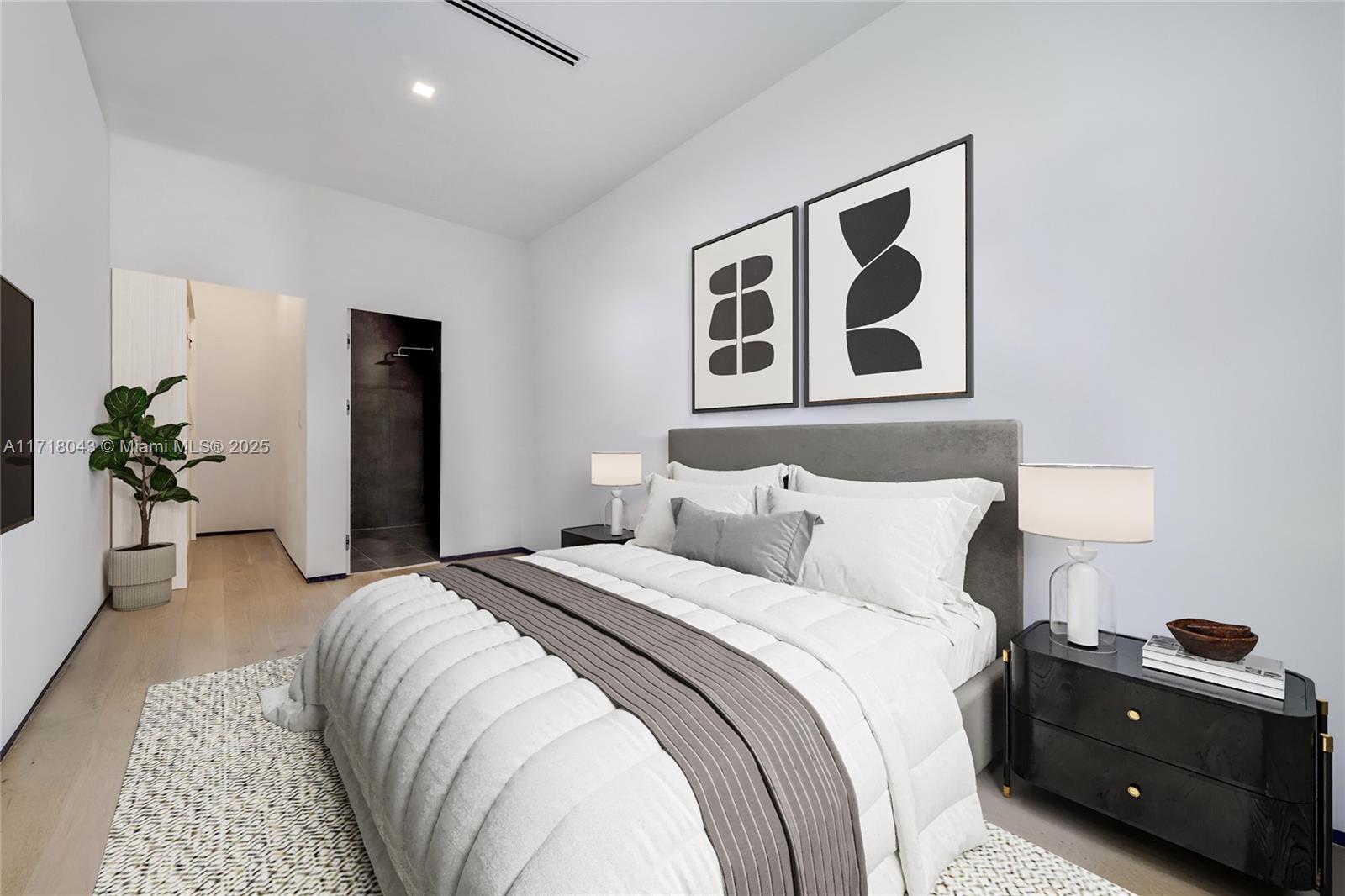 2725 Southwest 19th Street Miami, FL 33145 - Photo 14 of 49 a bedroom with a bed and a potted plant