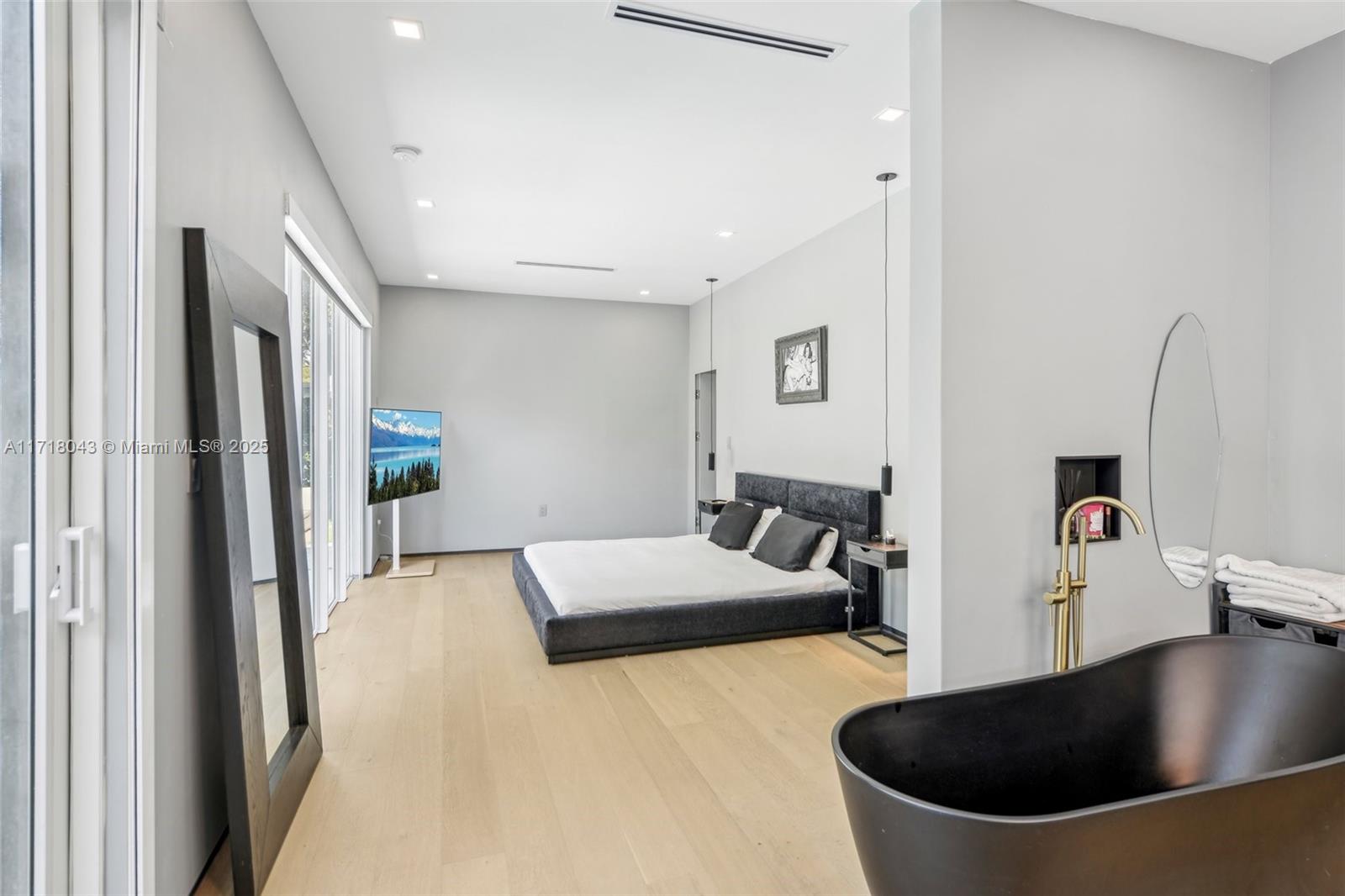2725 Southwest 19th Street Miami, FL 33145 - Photo 26 of 49 a living room with stainless steel appliances furniture a refrigerator and a sink