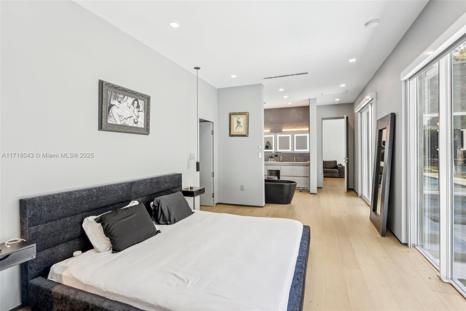 2725 Southwest 19th Street Miami, FL 33145 - Photo 32 of 49 a bedroom with a large bed and a view of bedroom