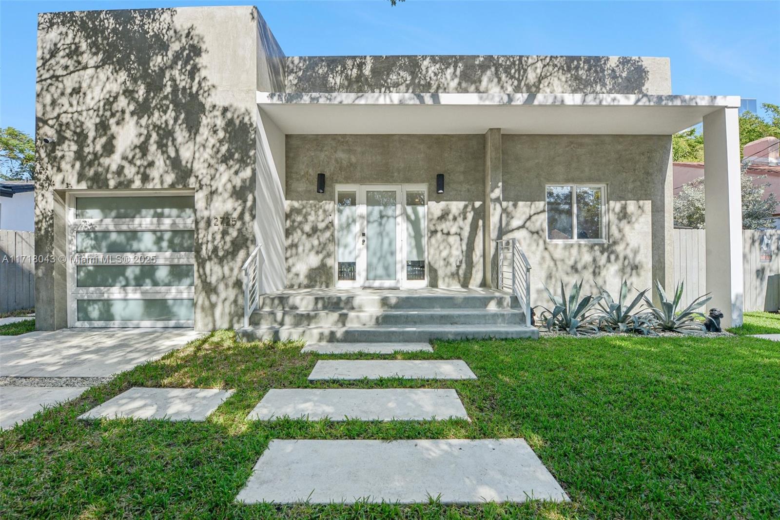 2725 Southwest 19th Street Miami, FL 33145 - Photo 5 of 49 a view of front door of house with yard