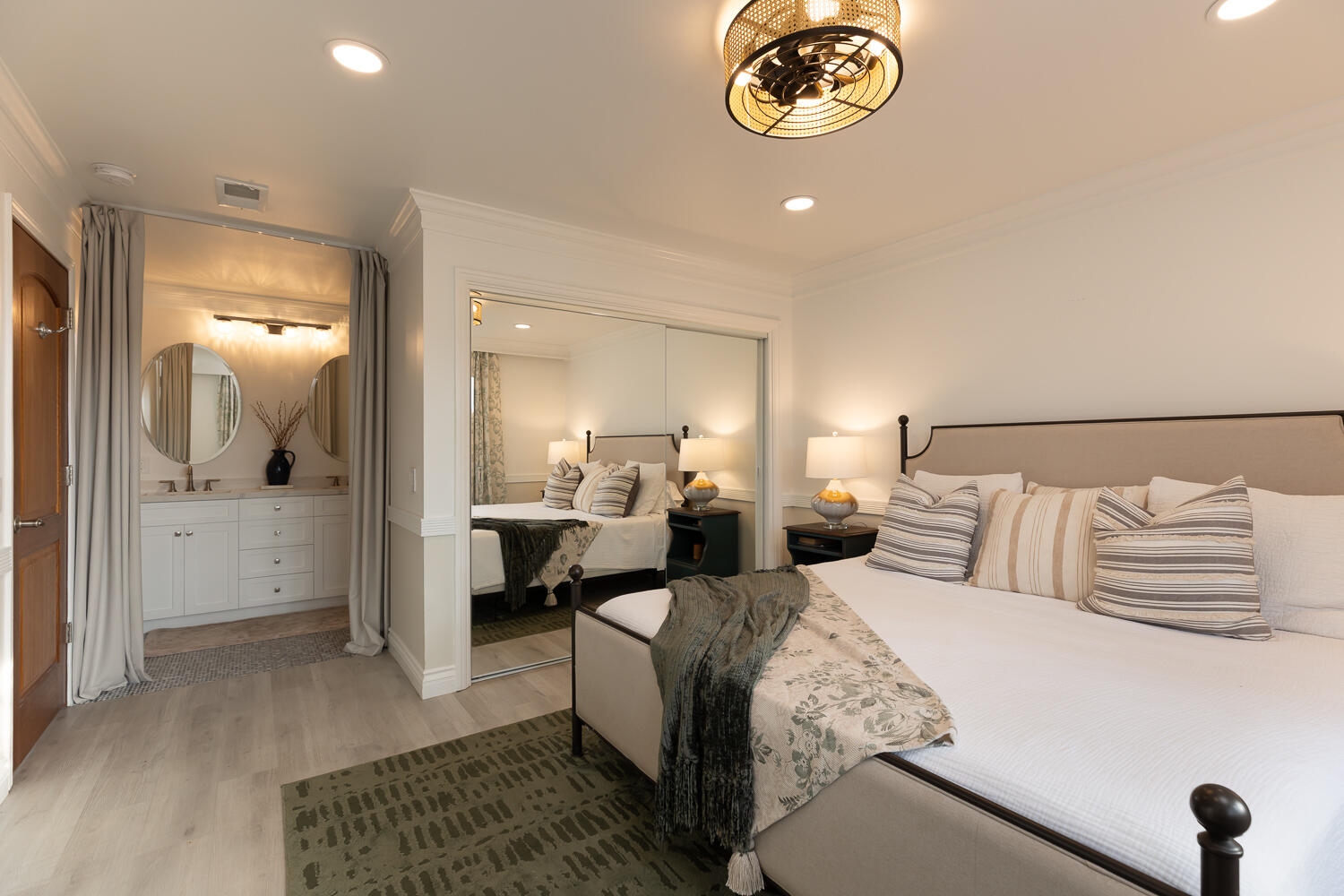5402 Cameo Road Carpinteria, CA 93013 - Photo 11 of 28 a bedroom with a bed and a chandelier