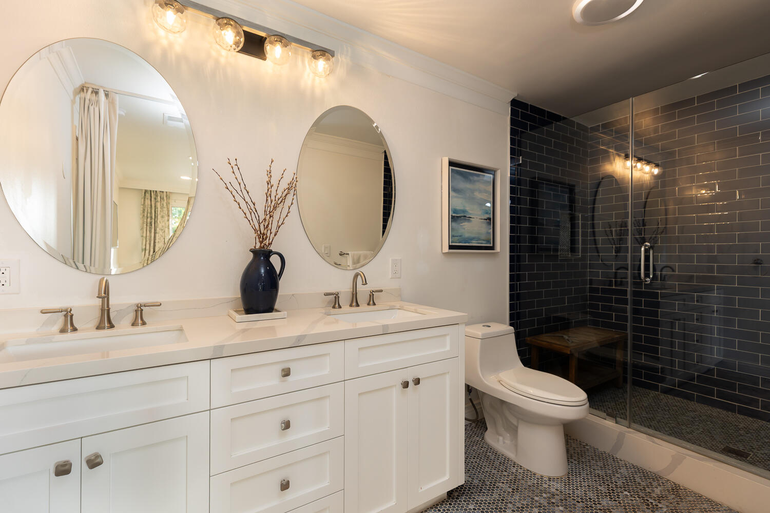 5402 Cameo Road Carpinteria, CA 93013 - Photo 12 of 28 a bathroom with a toilet sink double vanity and mirror