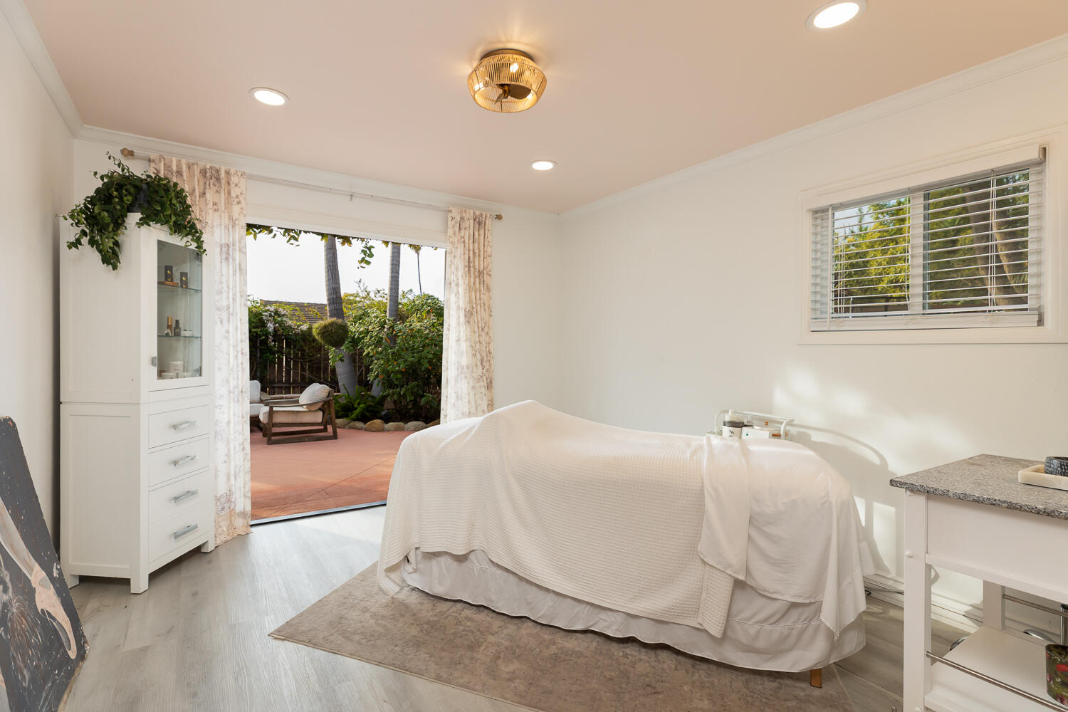 5402 Cameo Road Carpinteria, CA 93013 - Photo 14 of 28 a bedroom with a bed and a large window