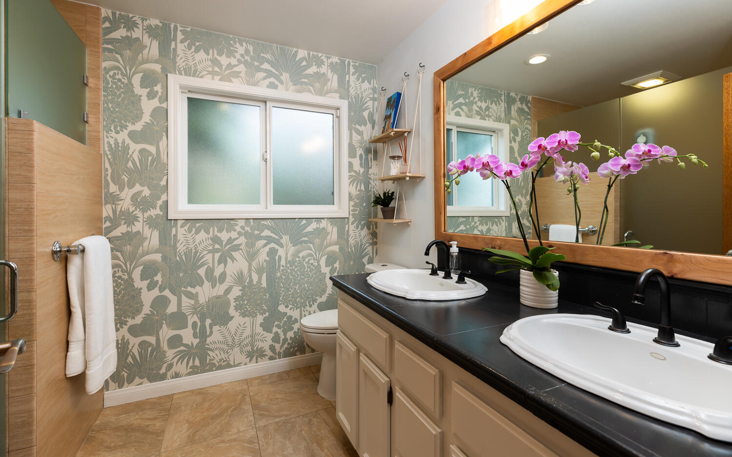 5402 Cameo Road Carpinteria, CA 93013 - Photo 15 of 28 a bathroom with a granite countertop sink a large mirror and a shower
