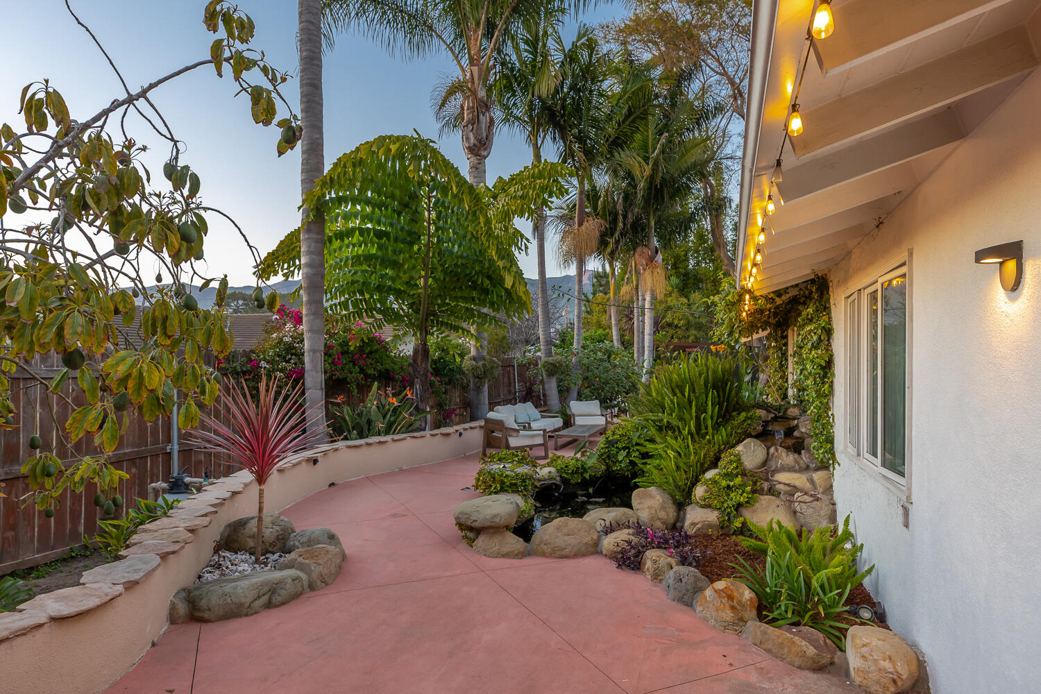 5402 Cameo Road Carpinteria, CA 93013 - Photo 21 of 28 a backyard of a house with lots of green space