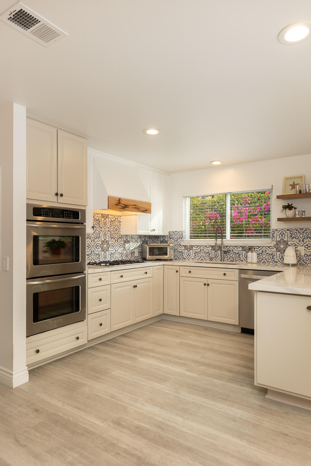 5402 Cameo Road Carpinteria, CA 93013 - Photo 8 of 28 a kitchen with granite countertop white cabinets and white appliances