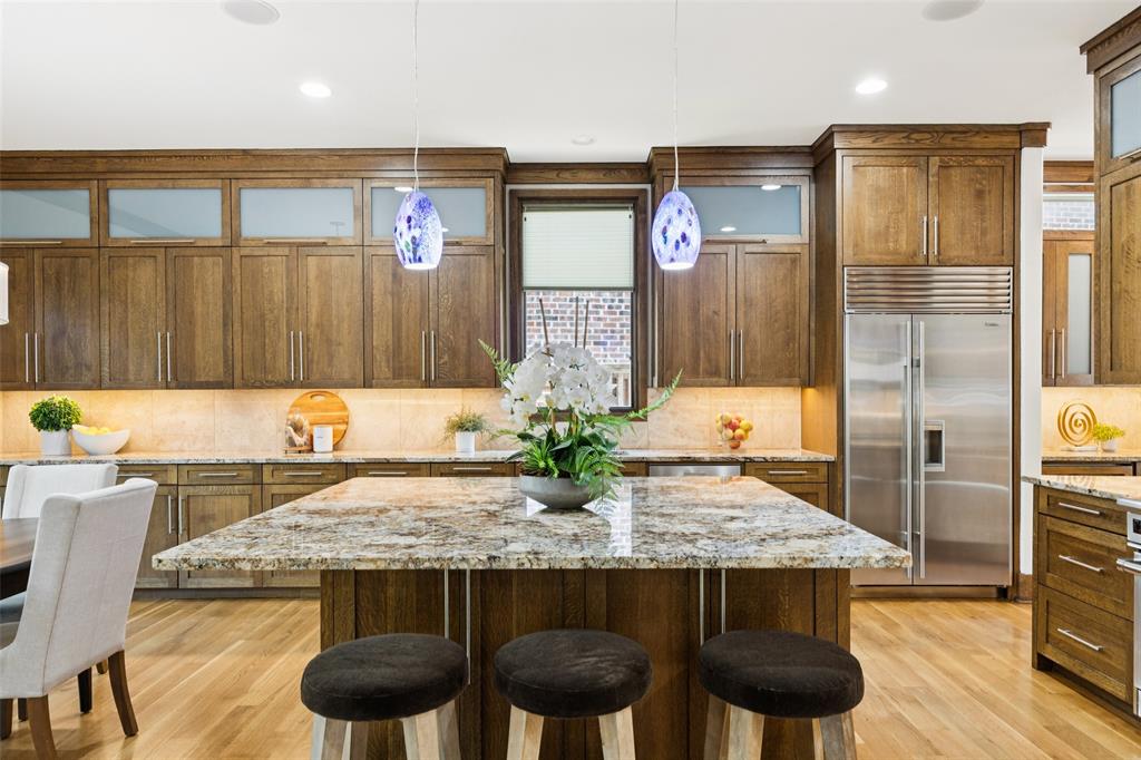6757 Lakefair Circle Dallas, TX 75214 - Photo 16 of 40 a view of kitchen island kitchen island dining table and chairs