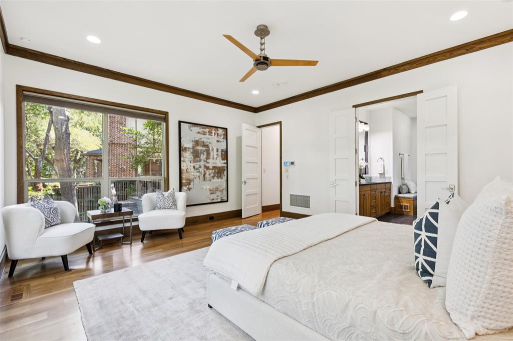 6757 Lakefair Circle Dallas, TX 75214 - Photo 20 of 40 a bedroom with a bed couch and large window