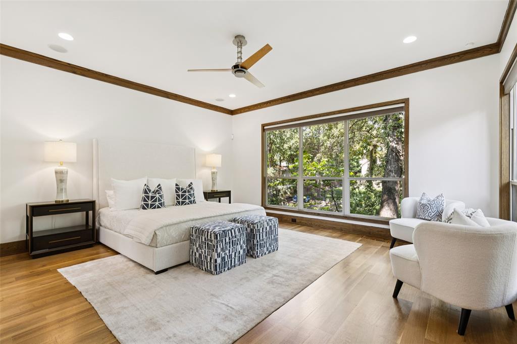 6757 Lakefair Circle Dallas, TX 75214 - Photo 21 of 40 a spacious bedroom with a large bed and a large window