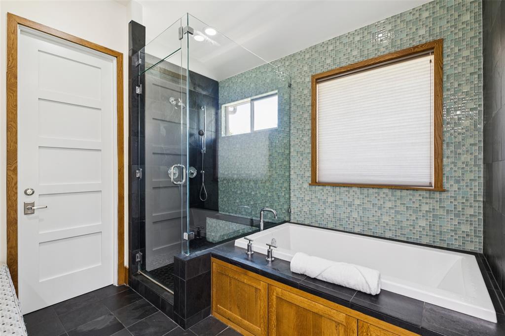 6757 Lakefair Circle Dallas, TX 75214 - Photo 23 of 40 a bathroom with a tub and a shower