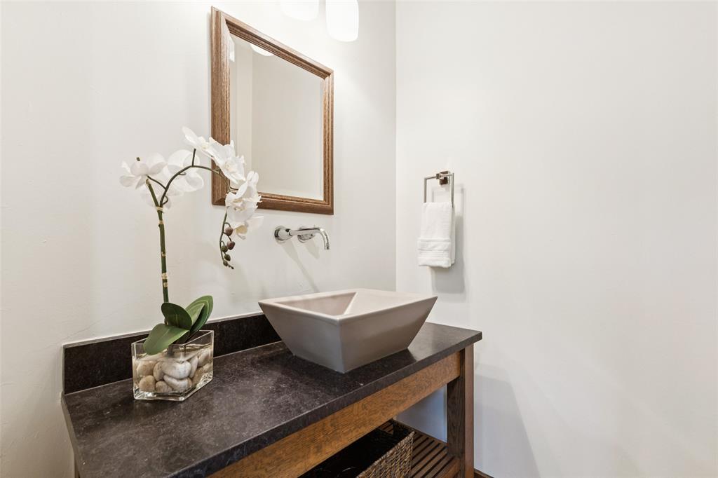 6757 Lakefair Circle Dallas, TX 75214 - Photo 25 of 40 a bathroom with a sink and a mirror