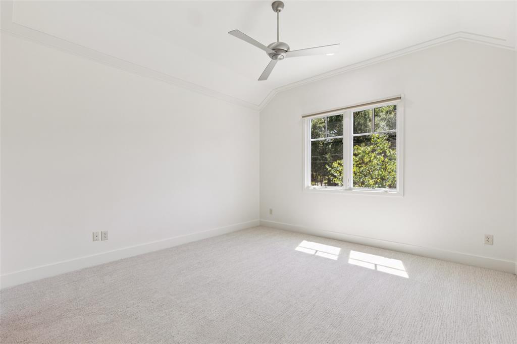 6757 Lakefair Circle Dallas, TX 75214 - Photo 32 of 40 an empty room with a window and ceiling fan