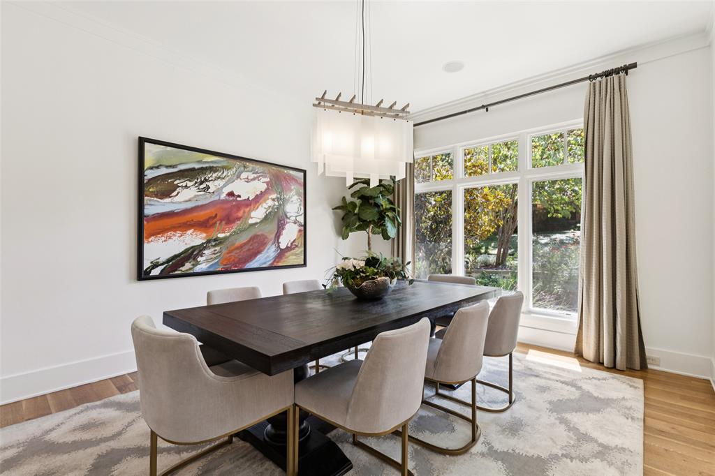 6757 Lakefair Circle Dallas, TX 75214 - Photo 6 of 40 a view of a dining room with furniture wooden floor and a chandelier