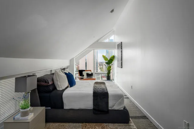 a living room with furniture and a lamp