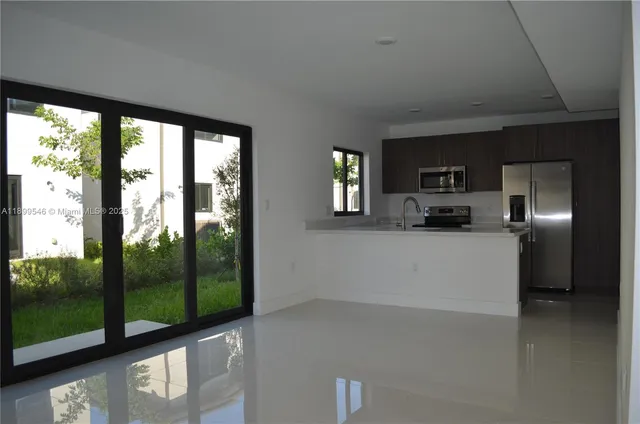 a view of a kitchen with a sink and dishwasher kitchen view