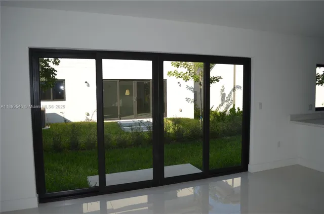 a kitchen with a sink and a refrigerator