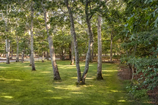 a swimming pool with outdoor seating and yard