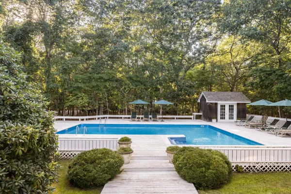 a view of a swimming pool with lounge chair