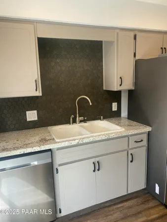 a sink with granite top and a sink
