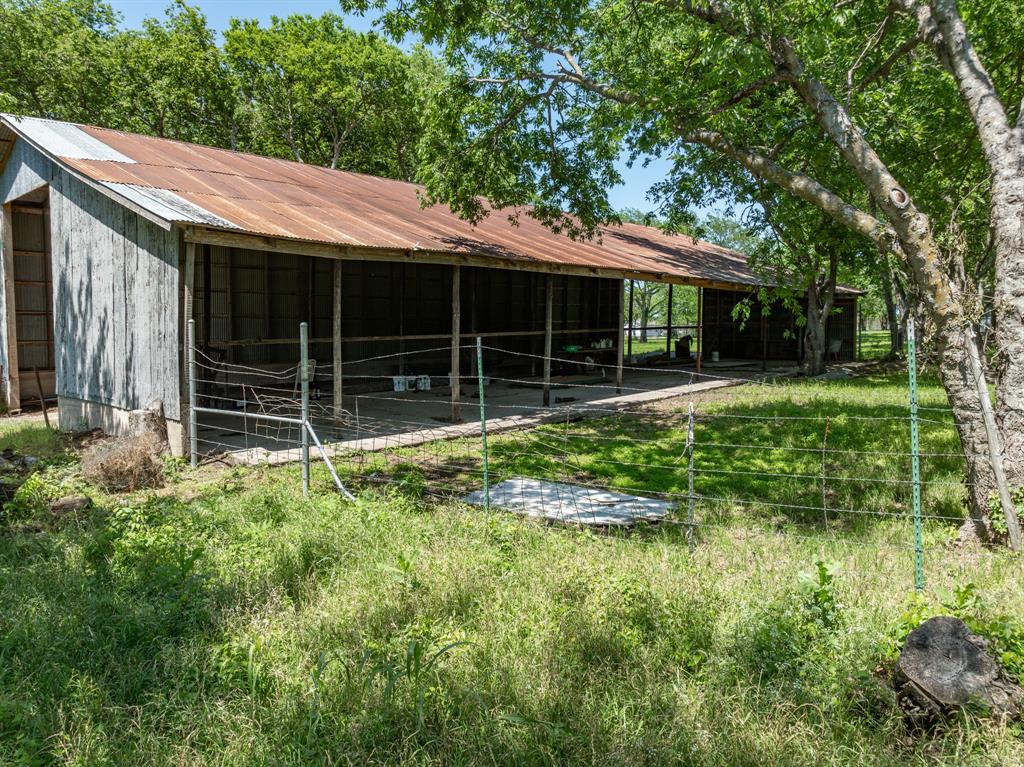 1355 North Houston Street Lorena, TX 76655 - Photo 17 of 40 a front view of a house with a garden