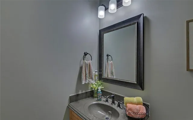 a front view of a house with a yard and green space