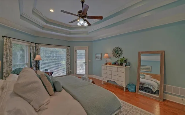 an aerial view of a house with a yard and pool