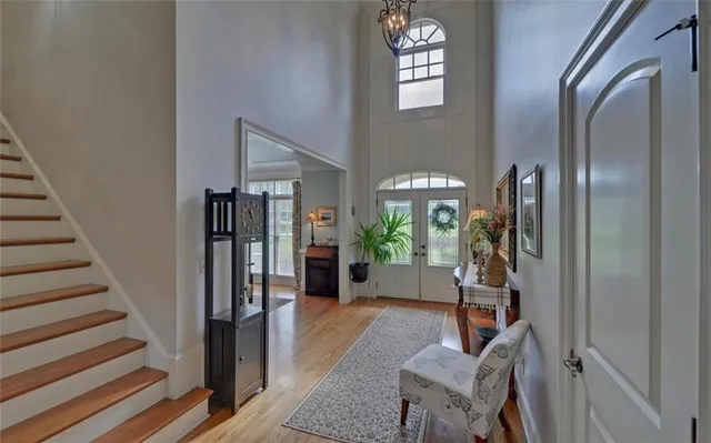 a view of a dining room with furniture and chandelier