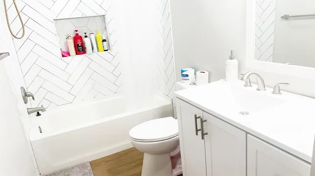 a bathroom with a sink a toilet and a bathtub