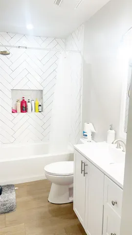 a spacious bedroom with a bed and a table