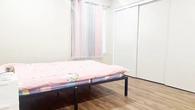 a view of a room with wooden floor