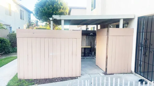 a view of a backyard with plants and a garden