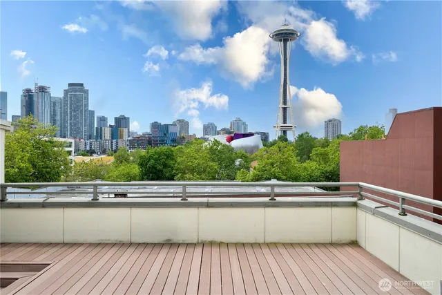 a view of a multi story residential apartment building with a yard