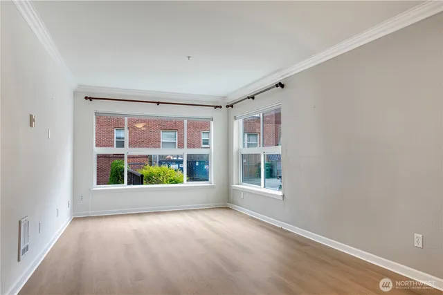 a view of an empty room with a window