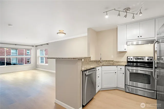 a kitchen with a stove and a sink