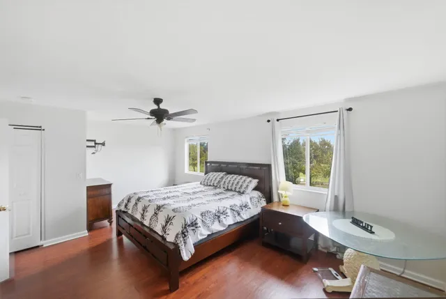 a bedroom with a bed and window