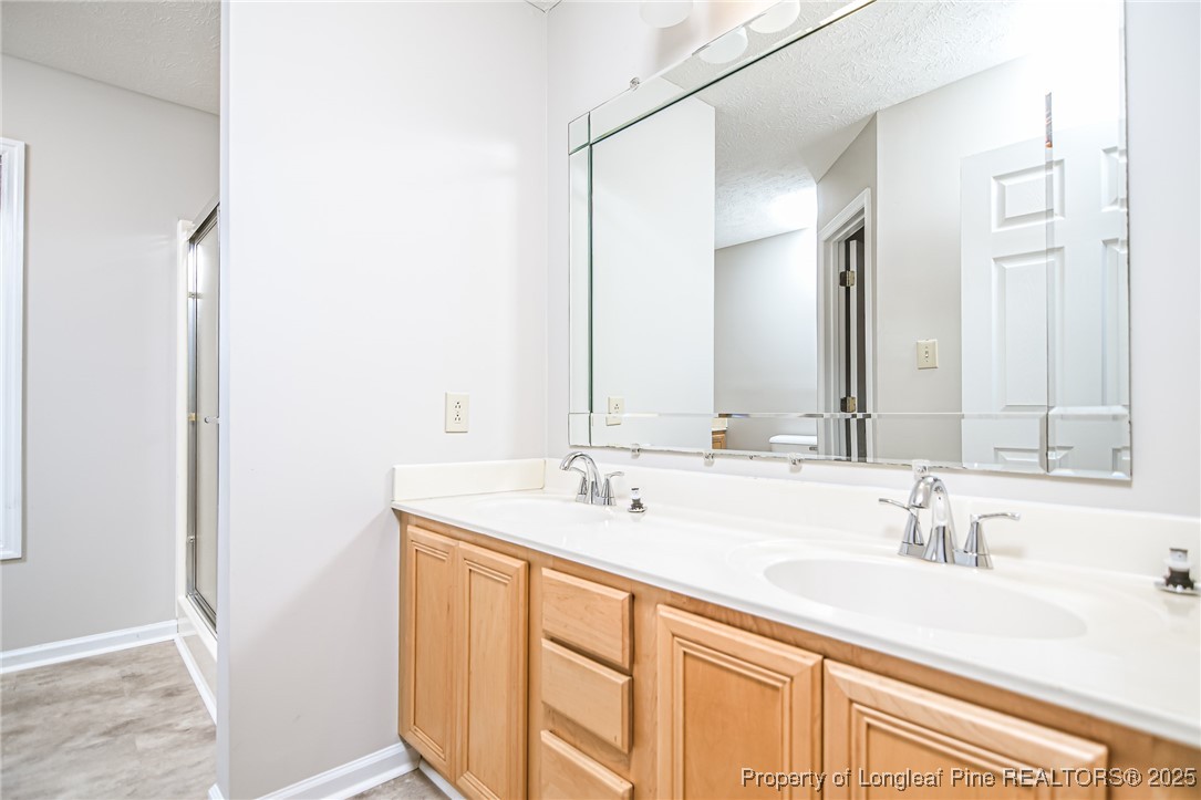 4735 Camden Road Fayetteville, NC 28306 - Photo 11 of 34 a bathroom with a sink and a mirror