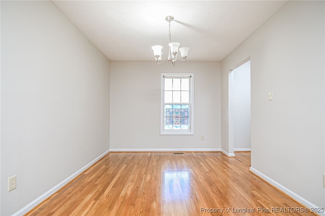 4735 Camden Road Fayetteville, NC 28306 - Photo 16 of 34 wooden floor in an empty room with a window